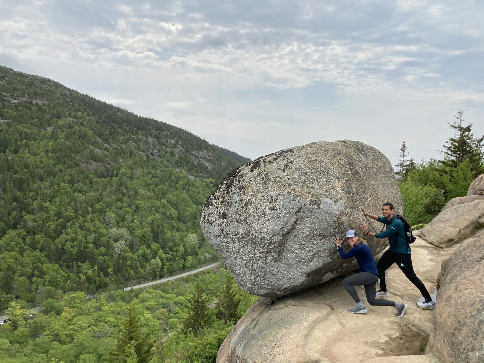 Ryan and his girlfriends pretending to push a boulder